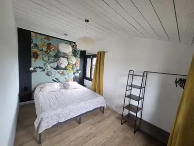 Un ou plusieurs lits dans un hébergement de l'établissement Appartement de Charme