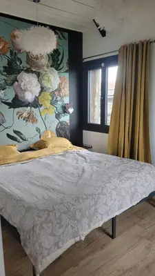Un ou plusieurs lits dans un hébergement de l'établissement Appartement de Charme