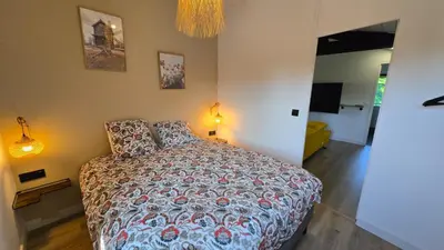 Un ou plusieurs lits dans un hébergement de l'établissement Appartement de Charme