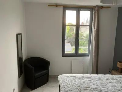 Un ou plusieurs lits dans un hébergement de l'établissement Grand appartement centre ville château St Pierre