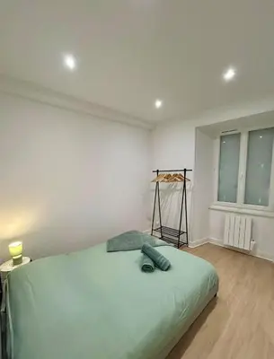 Un ou plusieurs lits dans un hébergement de l'établissement Quiet apartment - Touraine