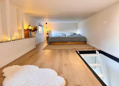 Un ou plusieurs lits dans un hébergement de l'établissement Tiny House cosy