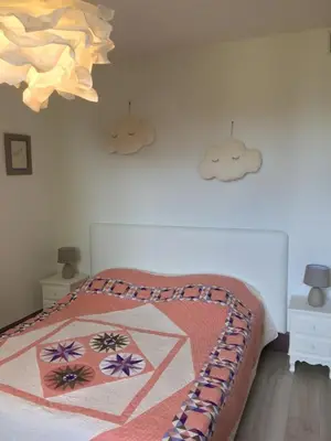 Un ou plusieurs lits dans un hébergement de l'établissement Gite Les petits balcons