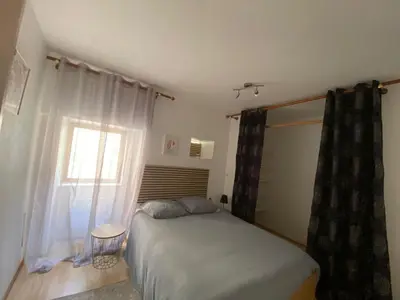 Un ou plusieurs lits dans un hébergement de l'établissement L'Oret'Home