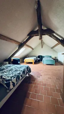 Un ou plusieurs lits dans un hébergement de l'établissement Gîte La Loge