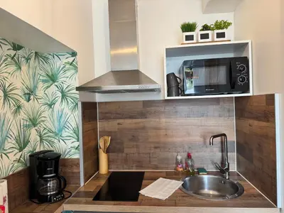 Cuisine ou kitchenette dans l'établissement Le Nid du Guesclin