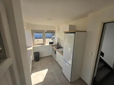 Cuisine ou kitchenette dans l'établissement Location au pied du circuit