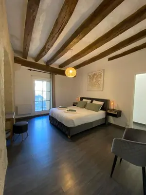 Un ou plusieurs lits dans un hébergement de l'établissement Appartement de charme L'écrin du Castel Classé 3 étoiles