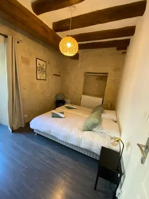 Un ou plusieurs lits dans un hébergement de l'établissement Appartement de charme L'écrin du Castel Classé 3 étoiles