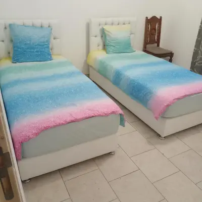 Un ou plusieurs lits dans un hébergement de l'établissement Maison agreable