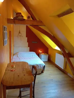 Un ou plusieurs lits dans un hébergement de l'établissement Gîte 3 chambres dans Longère aux Rosiers-sur-Loire