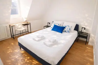 Un ou plusieurs lits dans un hébergement de l'établissement Le Charme d'Amboise