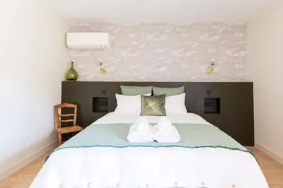 Un ou plusieurs lits dans un hébergement de l'établissement Les Chambres du Méteil