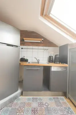 Cuisine ou kitchenette dans l'établissement Le Nid Citadin