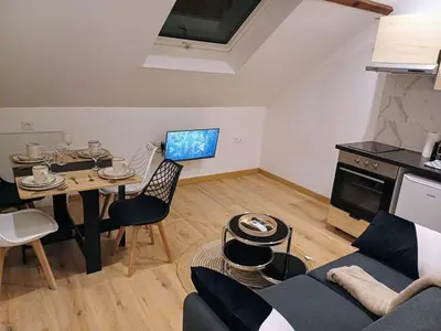 Cuisine ou kitchenette dans l'établissement Sobre, soft, accueillant, centre-ville