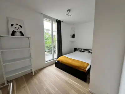 Un ou plusieurs lits dans un hébergement de l'établissement Belle Maison tout confort bord de Loire