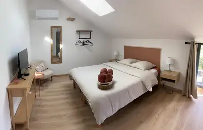 Un ou plusieurs lits dans un hébergement de l'établissement Maison en pierre, proche du Futuroscope