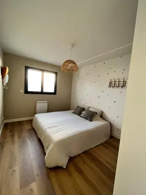 Un ou plusieurs lits dans un hébergement de l'établissement Maison 3 chambres
