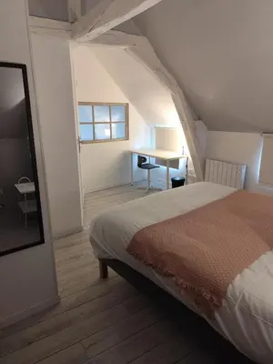 Un ou plusieurs lits dans un hébergement de l'établissement Logis troglodyte cosy & vue sur la Loire