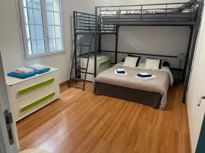 Un ou plusieurs lits dans un hébergement de l'établissement Chambres dans maison avec piscine toboggan aquatique et spa
