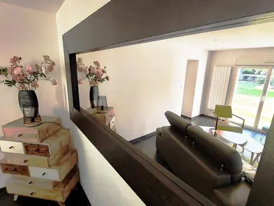 Coin salon dans l'établissement Charmante maison au calme avec jardin
