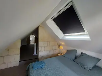 Un ou plusieurs lits dans un hébergement de l'établissement Charmante maison au calme avec jardin