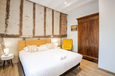 Un ou plusieurs lits dans un hébergement de l'établissement La Maison Renaissance Amboise 4 bedroom house