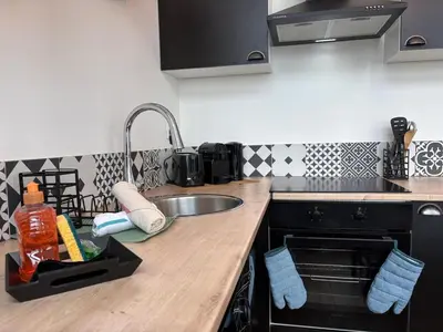 Cuisine ou kitchenette dans l'établissement Duplex lumineux centre-ville