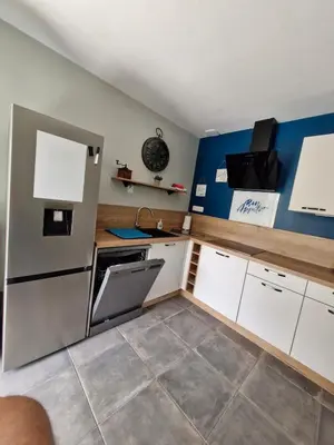 Cuisine ou kitchenette dans l'établissement Cosy la Riveraine Cottage