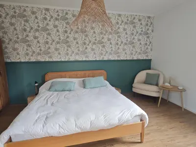 Un ou plusieurs lits dans un hébergement de l'établissement Grande chambre cosy très proche centre ville