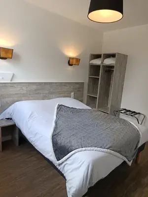 Un ou plusieurs lits dans un hébergement de l'établissement Le Relais Du Velors