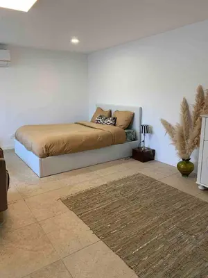 Un ou plusieurs lits dans un hébergement de l'établissement Grand studio cosy avec terrasse