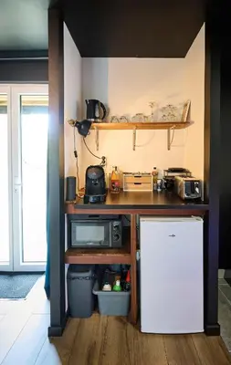 Cuisine ou kitchenette dans l'établissement L'Escapade Balnéo, proche Gare, Centre ville, Circuit des 24H