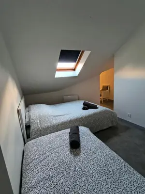 Un ou plusieurs lits dans un hébergement de l'établissement Appartement La cabane perchée 9 personnes wifi