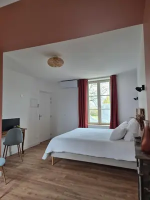 Un ou plusieurs lits dans un hébergement de l'établissement Les chambres de Marcel