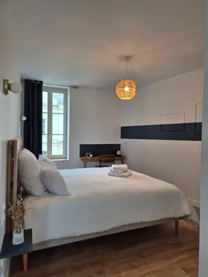 Un ou plusieurs lits dans un hébergement de l'établissement Les chambres de Marcel