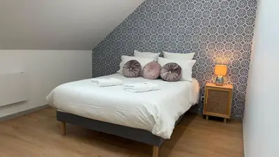 Un ou plusieurs lits dans un hébergement de l'établissement Le Cosy Gîte de Blois - Terrasse privée - 6 pers