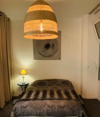 Un ou plusieurs lits dans un hébergement de l'établissement Appartement, en plein centre ville 55 m2