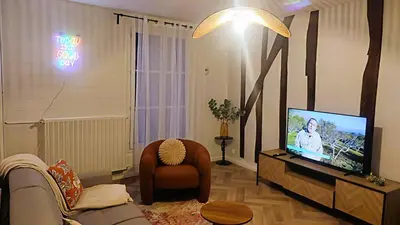 Télévision ou salle de divertissement dans l'établissement Le 10 du NC - Appartement cosy