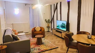 Télévision ou salle de divertissement dans l'établissement Le 10 du NC - Appartement cosy