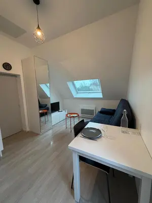 Coin salon dans l'établissement Petit studio tout confort - proche Angers