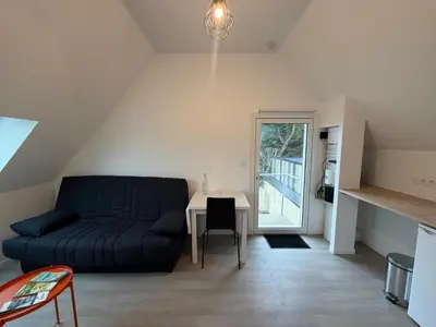 Coin salon dans l'établissement Petit studio tout confort - proche Angers