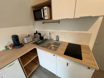 Cuisine ou kitchenette dans l'établissement Petit studio tout confort - proche Angers