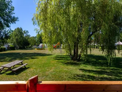 Jardin de l'établissement Mobil-home confortable avec terrasse - API-1-52-1100