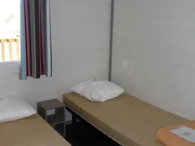 Un ou plusieurs lits dans un hébergement de l'établissement Chalet confortable avec terrasse - 6 pers. - API-1-52-1110