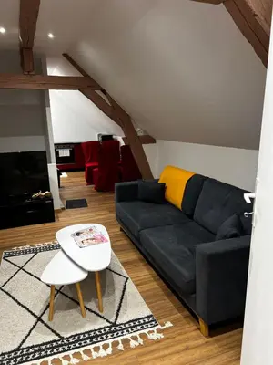 Coin salon dans l'établissement Cozy loft between zoo and castles