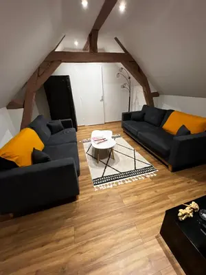 Coin salon dans l'établissement Cozy loft between zoo and castles
