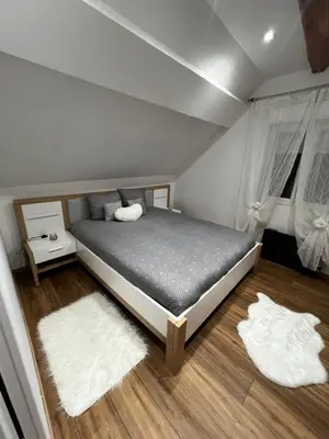 Un ou plusieurs lits dans un hébergement de l'établissement Cozy loft between zoo and castles