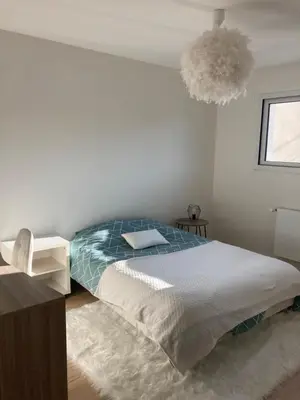 Un ou plusieurs lits dans un hébergement de l'établissement Cozy M&O House