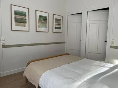 Un ou plusieurs lits dans un hébergement de l'établissement Maison WILSON